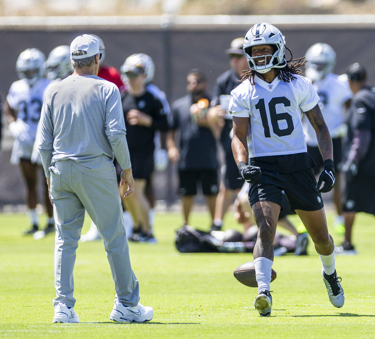 Raiders wide receiver Jakobi Meyers (16) looks to head coach Pete Carroll after a pass was thro ...