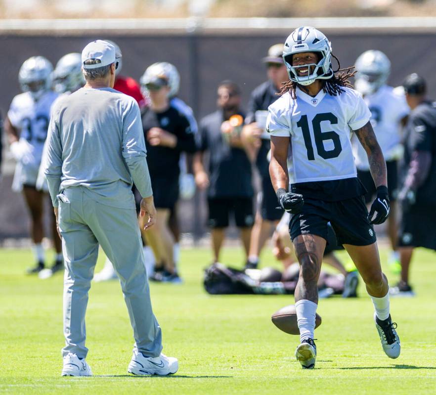 Raiders wide receiver Jakobi Meyers (16) looks to head coach Pete Carroll after a pass was thro ...