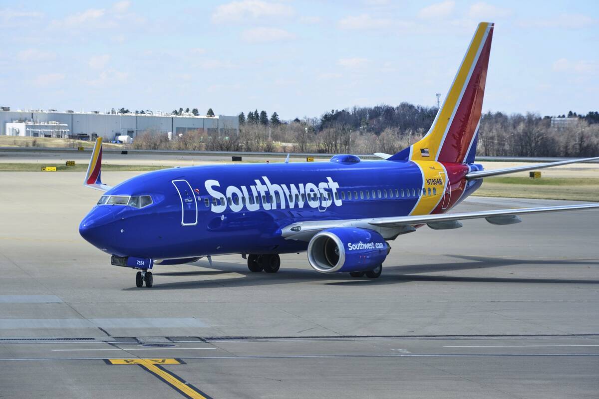 A Southwest Airlines plane pull into a gate at Pittsburgh International Airport in Imperial, Pa ...