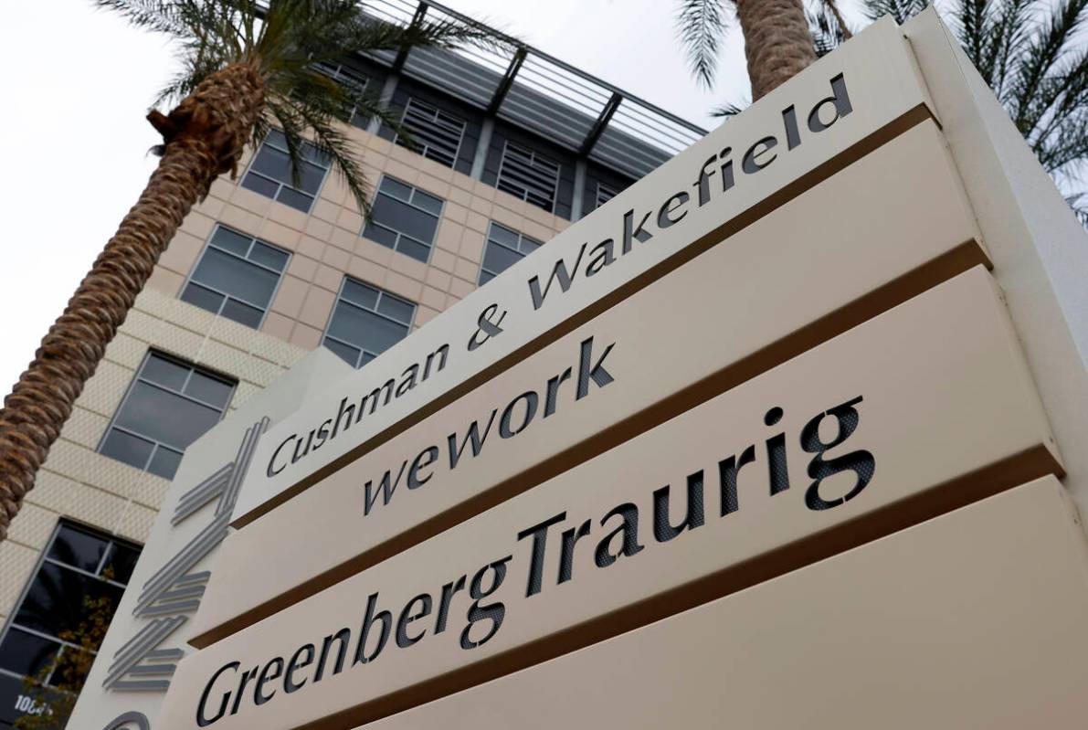 Signage with law firm Greenberg Traurig's name is seen outside of an office building in Las Veg ...