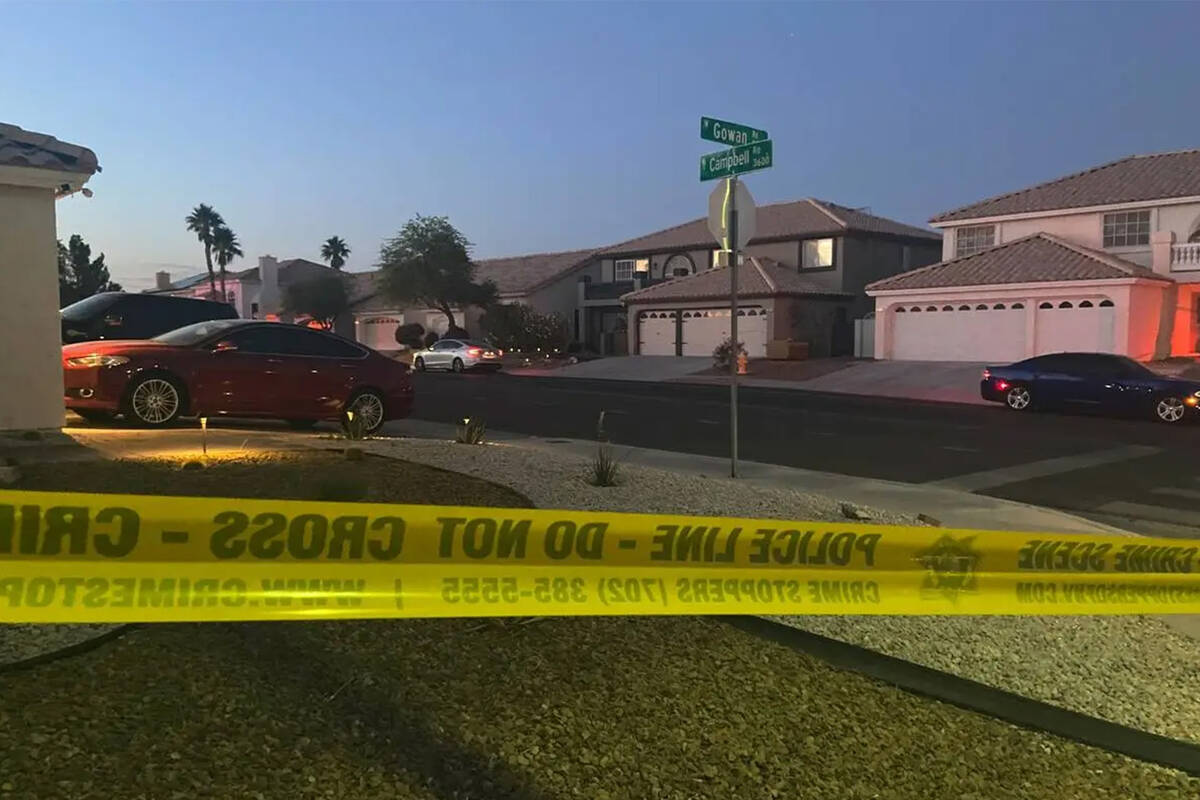 Police work at the scene of a homicide in the 3600 block of North Campbell Road in Las Vegas on ...
