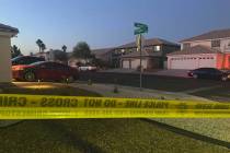 Police work at the scene of a homicide in the 3600 block of North Campbell Road in Las Vegas on ...