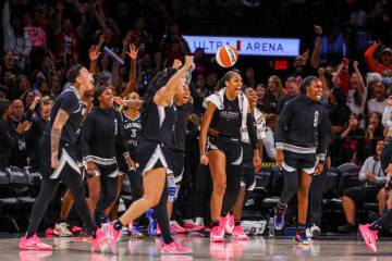 The Aces bench celebrates as the buzzer sounds, marking a win for the team in a pre-season game ...