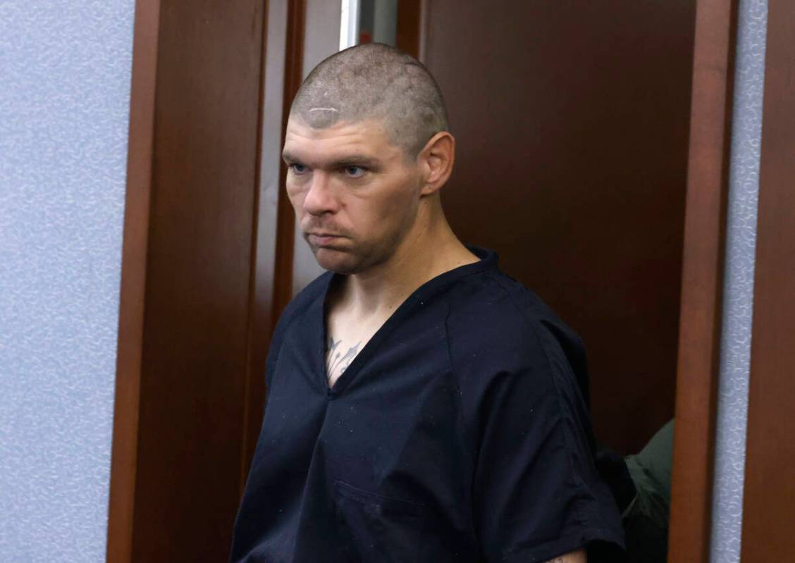 Mason Mireles, a suspect in fatal apartment stabbing, is led into a courtroom during a hearing ...