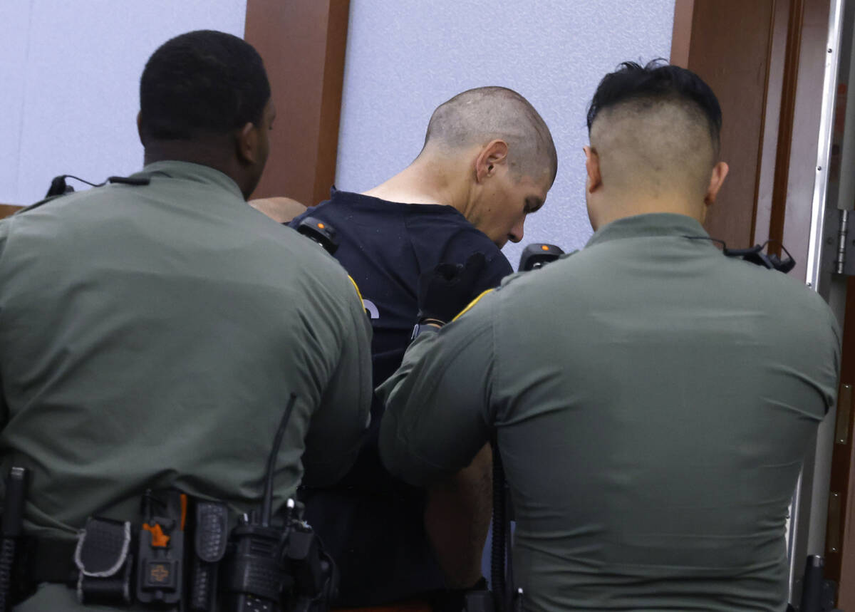 Mason Mireles, a suspect in fatal apartment stabbing, is led out of a courtroom after a hearing ...