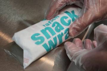 Wayne Kuhl, a McDonald's chef, wraps a snack wrap at McDonald's Headquarter in Chicago, Thursda ...