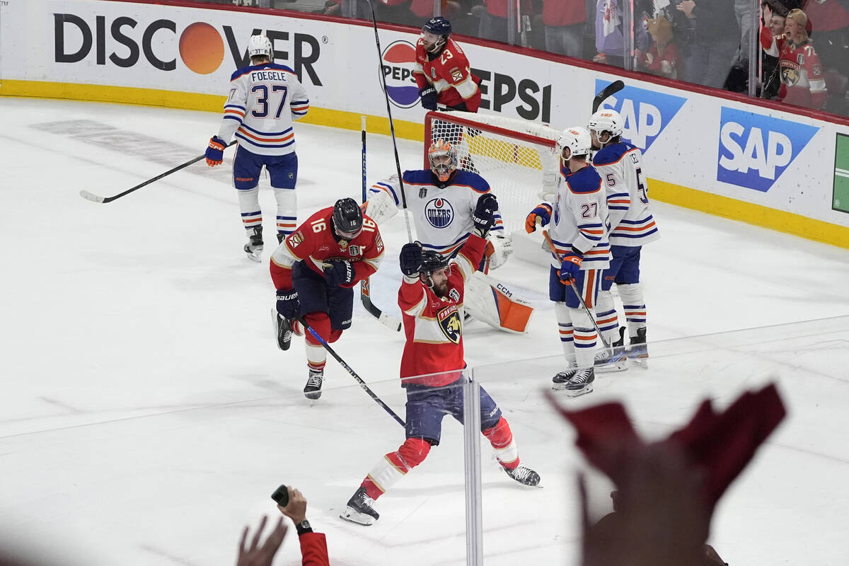 FILE - Florida Panthers players celebrate a goal by Sam Reinhart, not shown, during the second ...