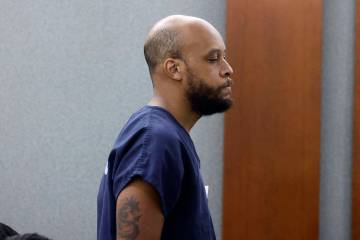 Christopher Rainey, who is accused of killing his landlord, appears in court during his arraign ...