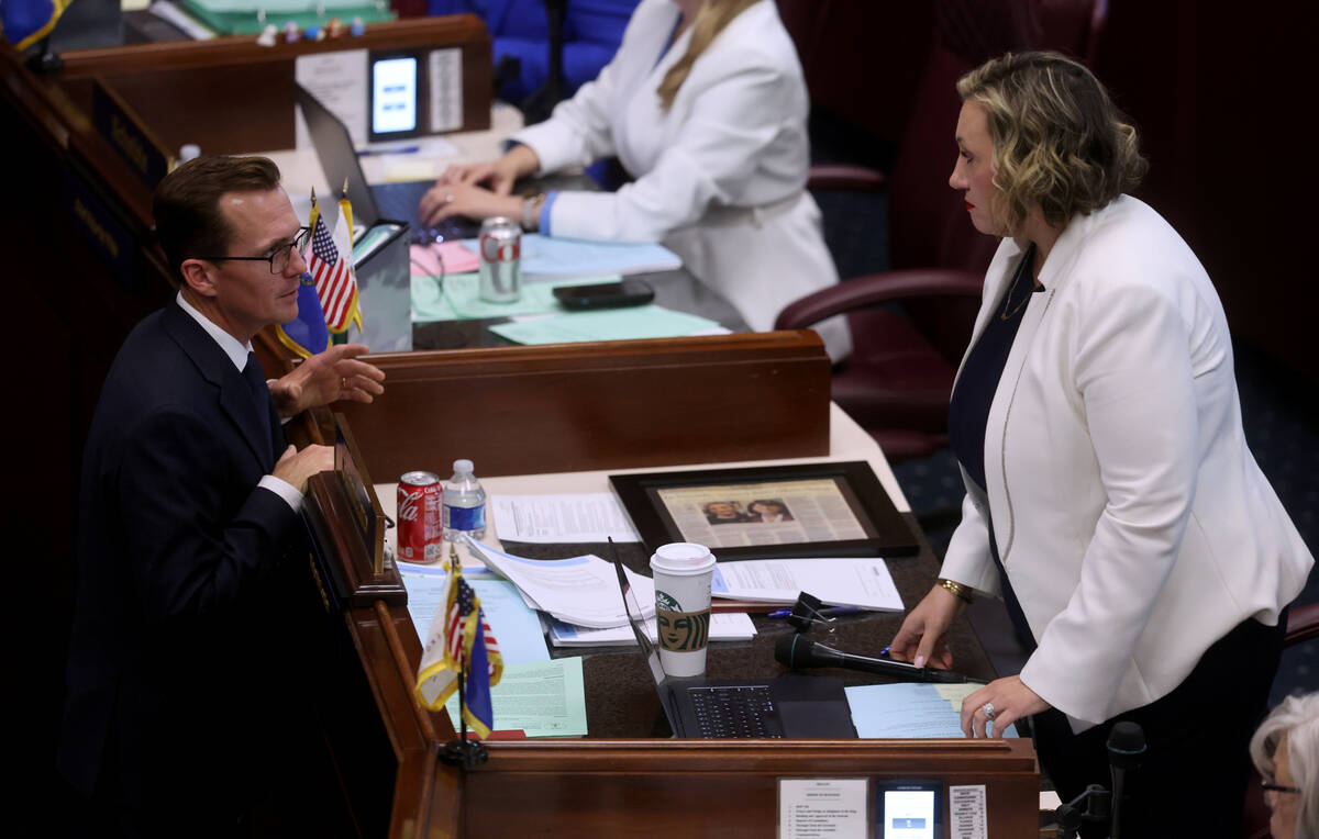 Senate Majority Leader Nicole Cannizzaro, D-Las Vegas, talks to Secretary of the Senate Brendan ...