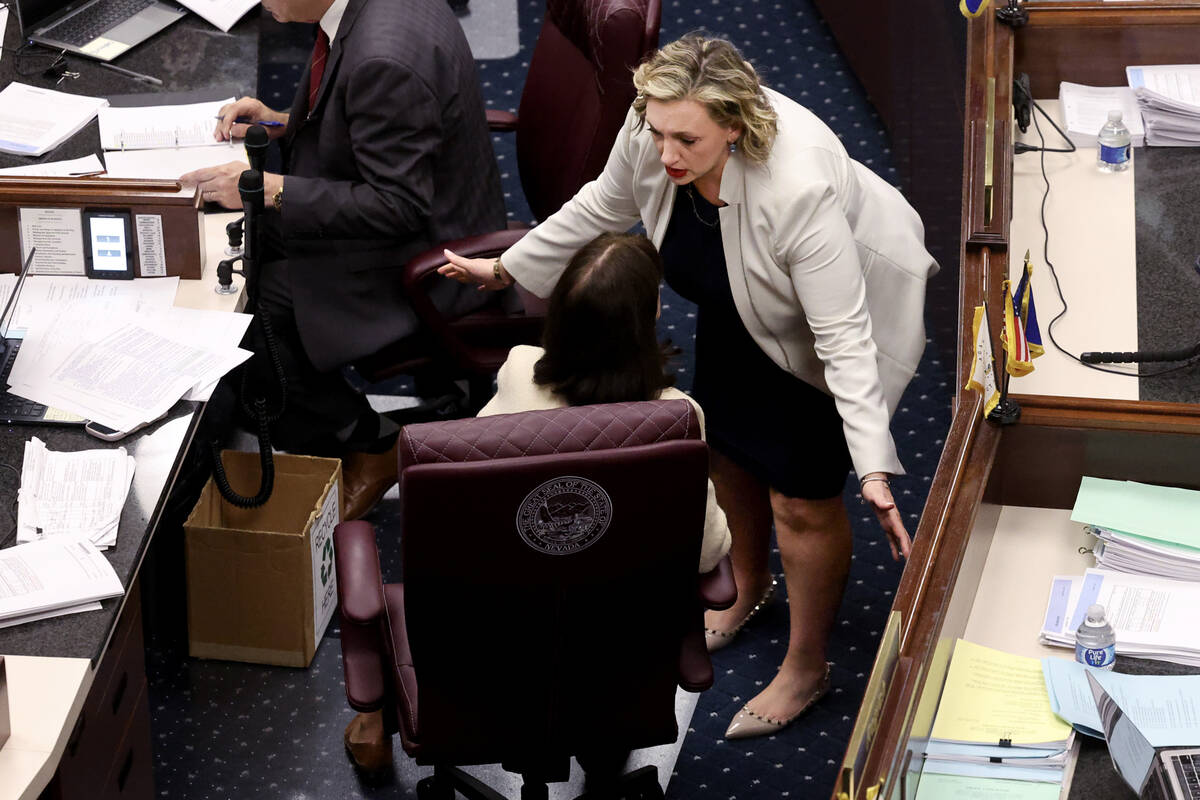 Senate Majority Leader Nicole Cannizzaro, D-Las Vegas, top, talks to Sen. Robin Titus, R-Wellin ...