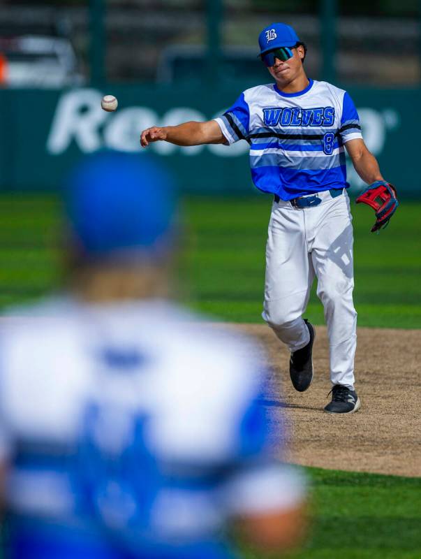 Basic infielder Tate Southisene (8) tosses the ball too first base against Reno during day one ...