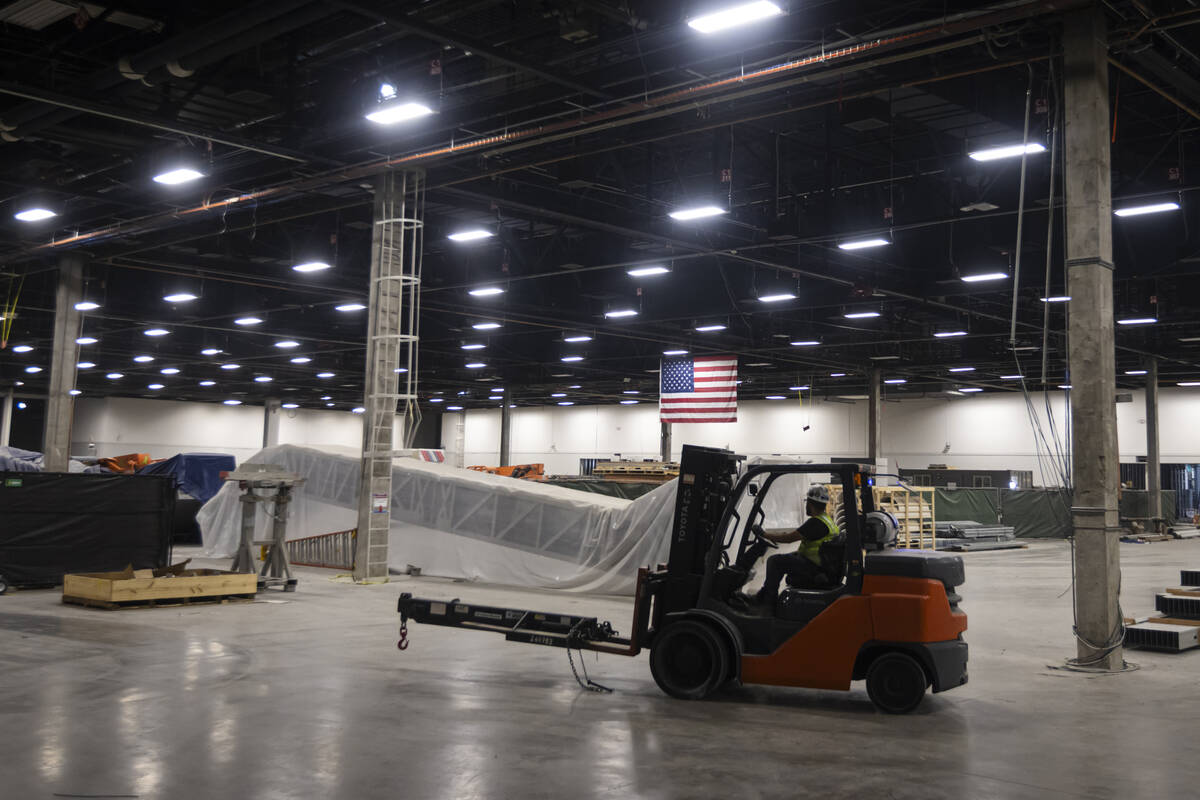 A forklift drivers passes by in the central hall during a tour of the Las Vegas Convention Cent ...