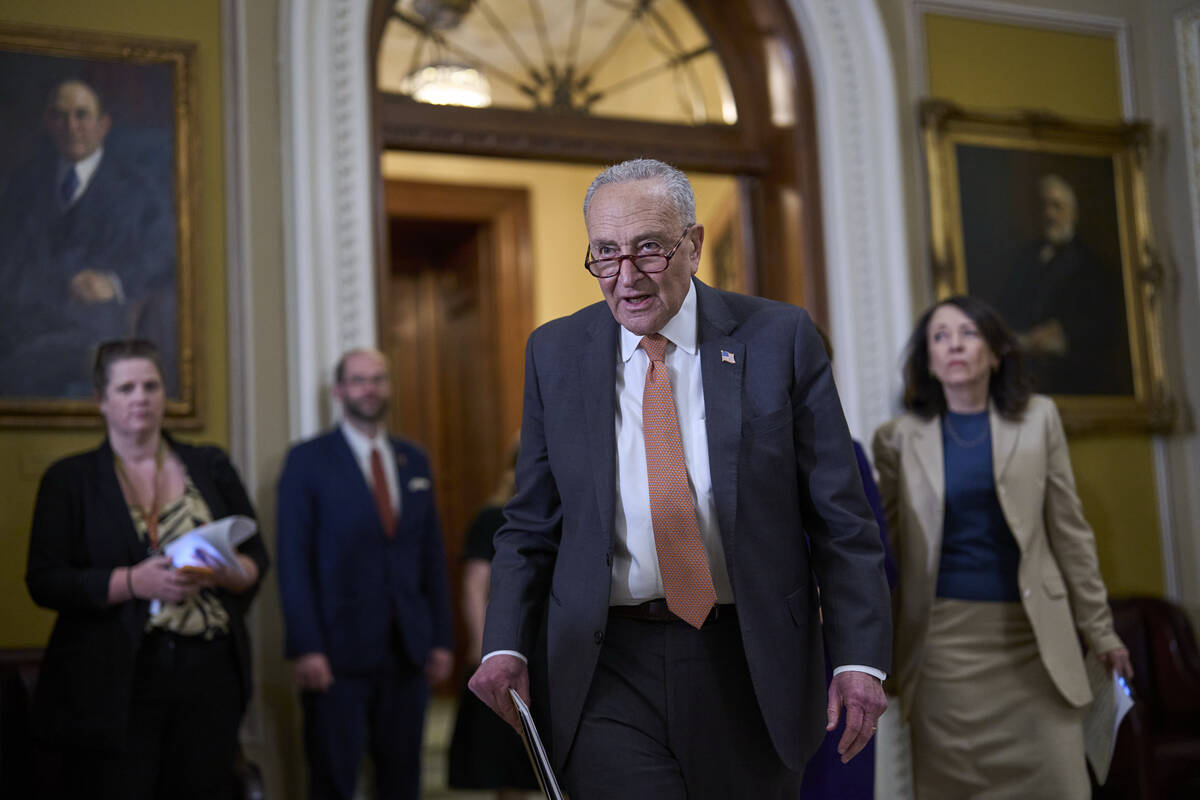 Senate Minority Leader Chuck Schumer, D-N.Y., arrives for a news conference where he commented ...