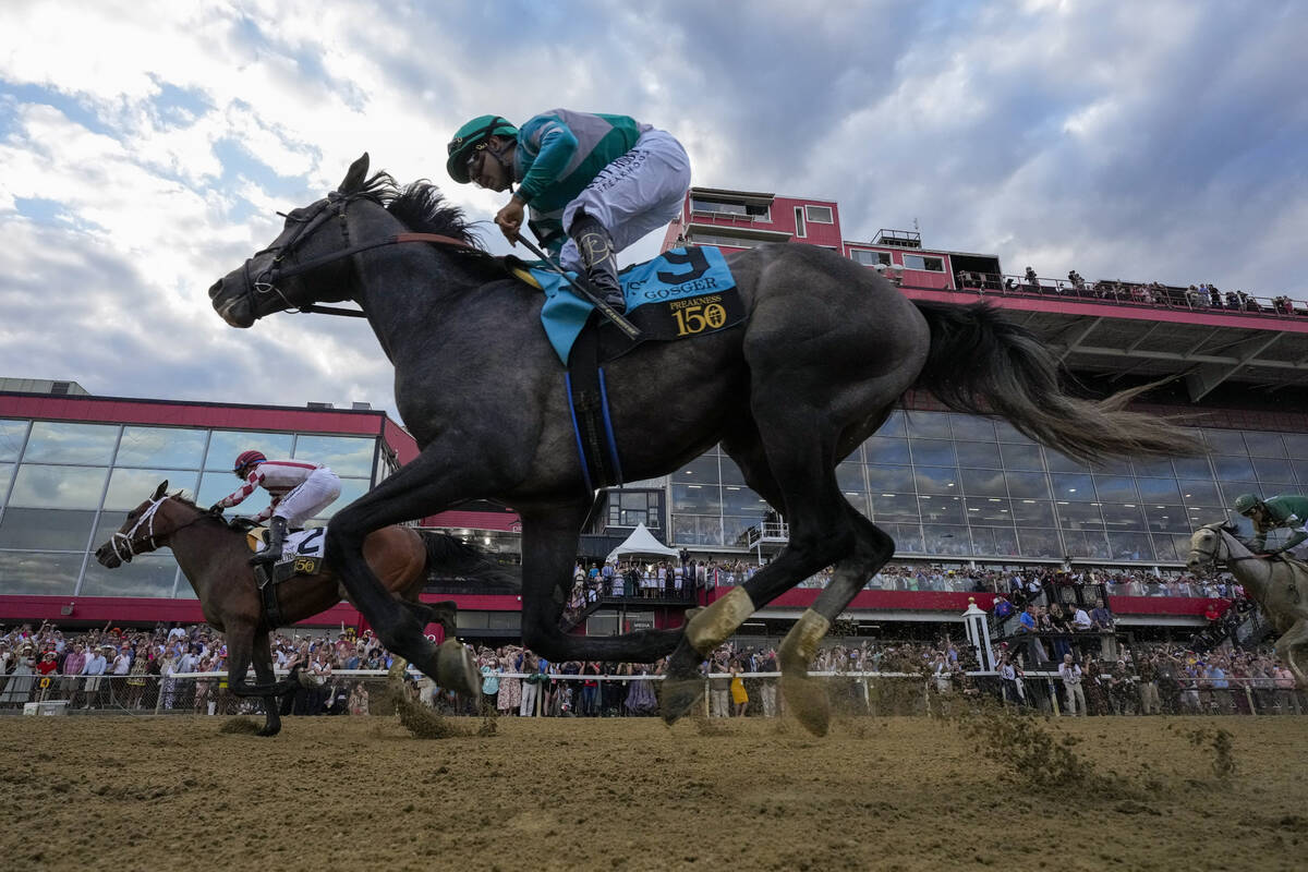 Umberto Rispoli, left, atop Journalism, edges out Luis Saez, atop Gosger, to win the 150th runn ...