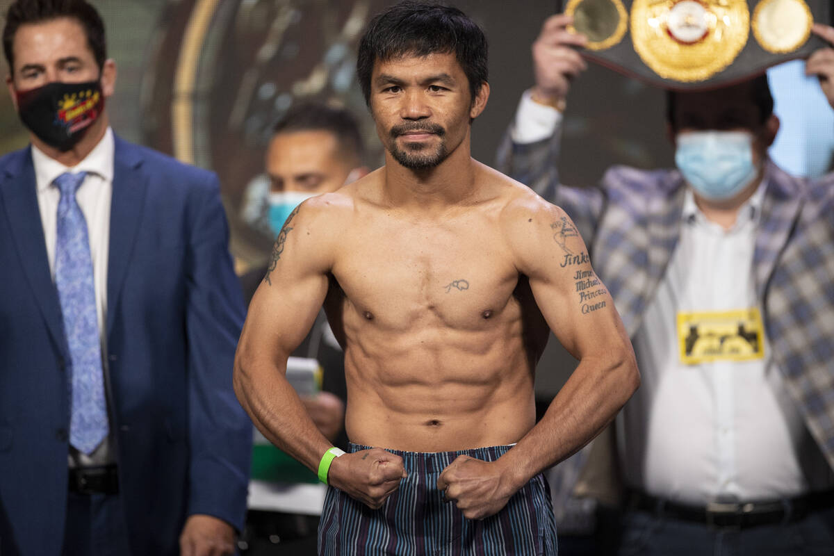 Manny Pacquiao poses for a portrait during a weigh-in event at the MGM Grand Garden Arena in La ...