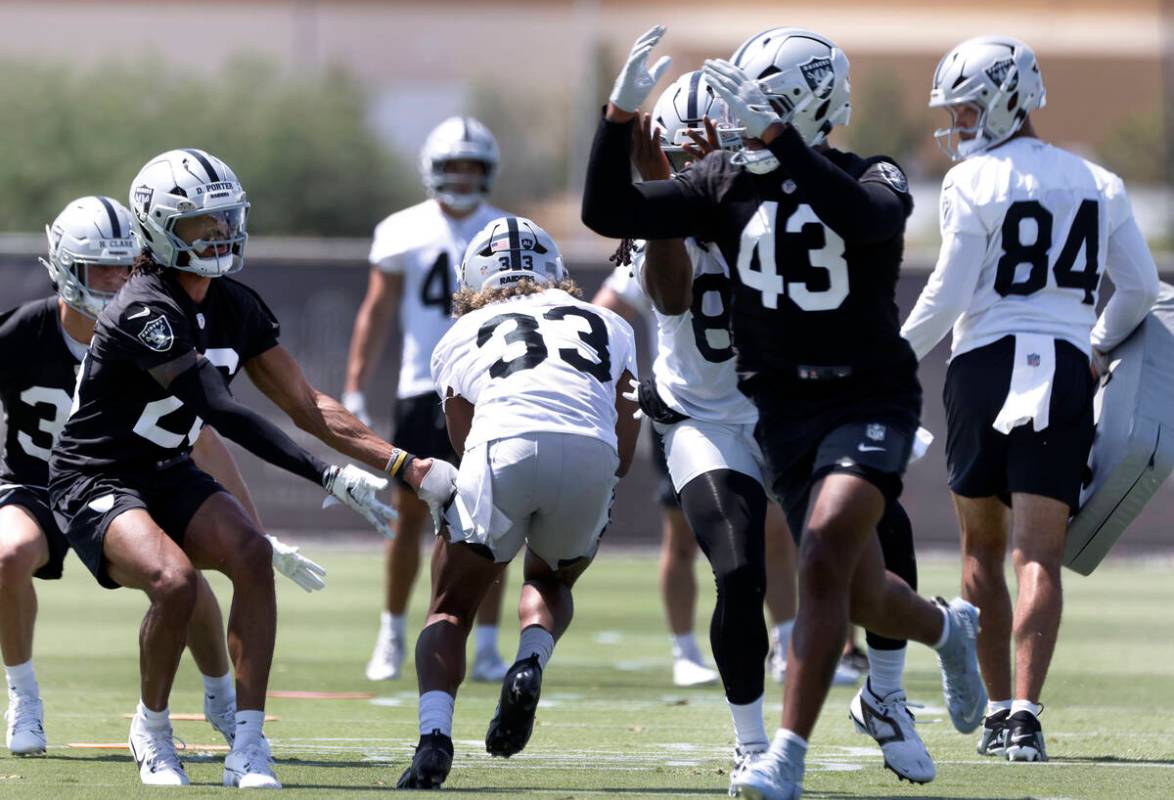 Raiders running back Chris Collier (33) runs through a drill during organized team activities a ...