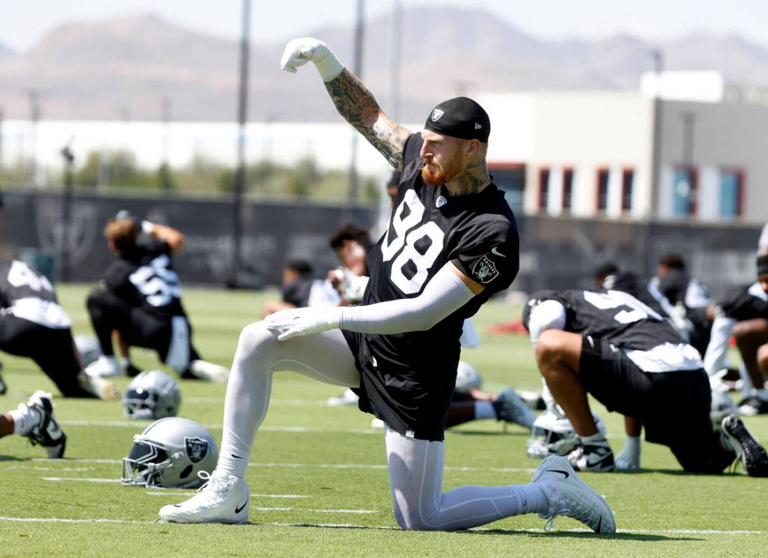 Raiders defensive end Maxx Crosby (98) stretches during organized team activities at the Interm ...