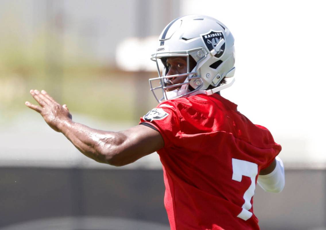 Raiders quarterback Geno Smith (7) prepares to throw the ball during organized team activities ...