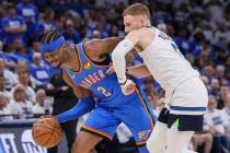 Oklahoma City Thunder guard Shai Gilgeous-Alexander (2) drives against Minnesota Timberwolves g ...