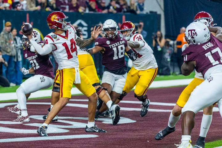 USC Trojans quarterback Jayden Maiava (14) gets off a pass from the end zone as Texas A&M A ...