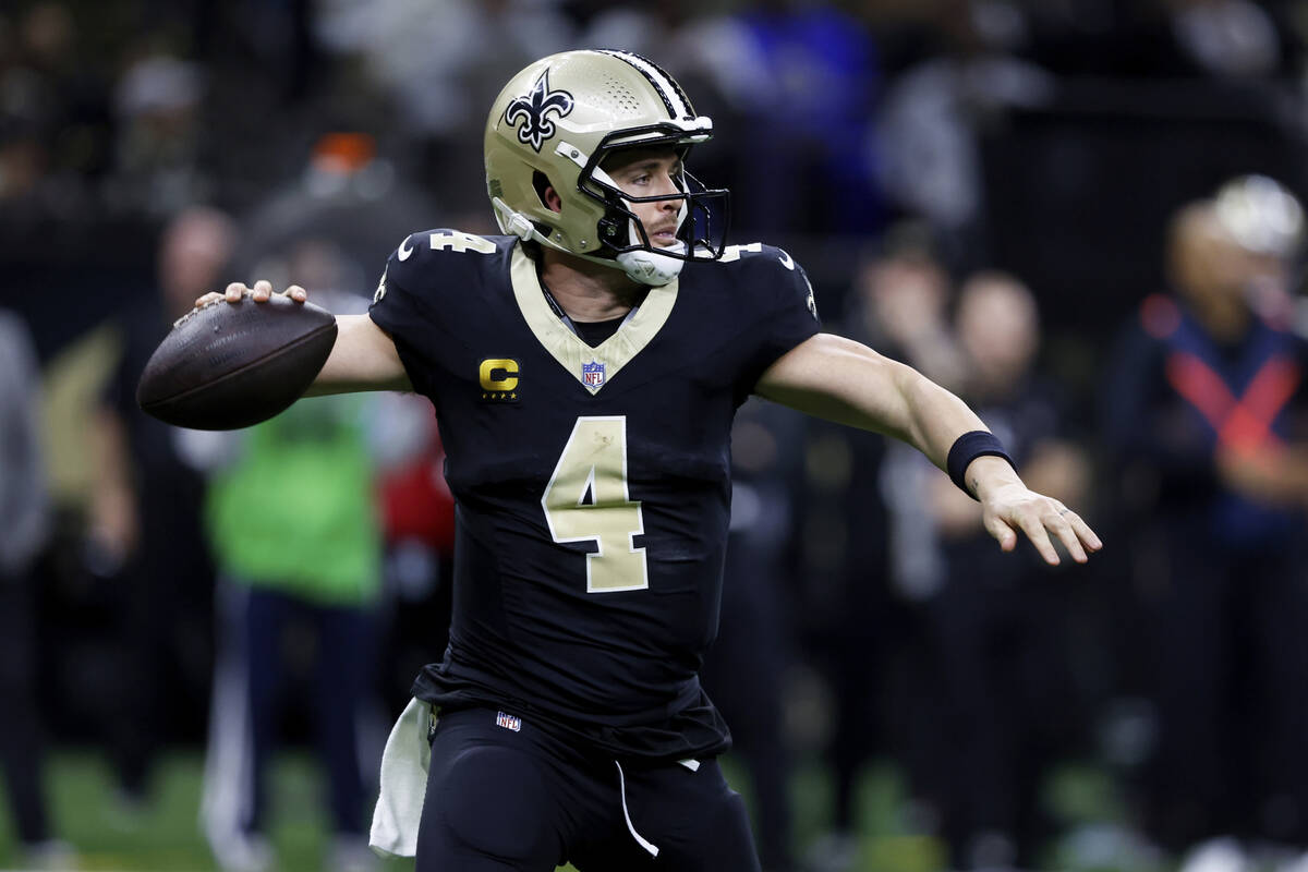 New Orleans Saints quarterback Derek Carr (4) prepares to throw a pass during the second half o ...