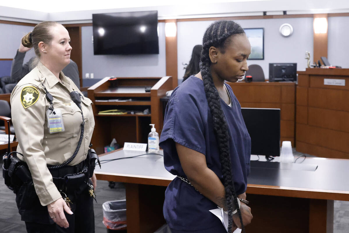 Markeisha Foster, accused of causing death of Reba the bulldog, is led out of a courtroom after ...