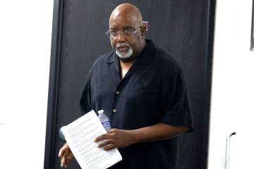 Dr. George Chambers, a local OB-GYN, enters the Nevada State Board of Medical Examiners office ...