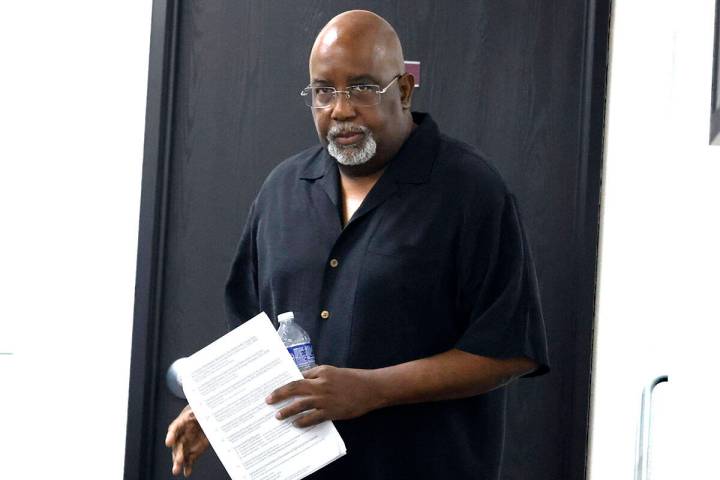 Dr. George Chambers, a local OB-GYN, enters the Nevada State Board of Medical Examiners office ...