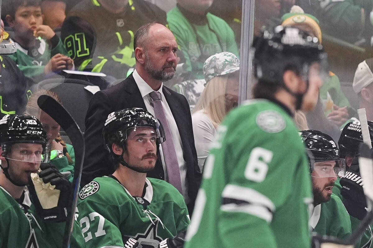 Dallas Stars head coach Pete DeBoer, center, watches play against the Winnipeg Jets in the seco ...