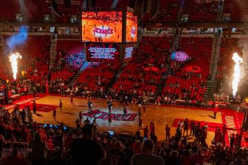Flames erupt above the baskets as UNLV is introduced to play the Boise State Broncos in their N ...