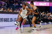 Golden State Valkyries guard Veronica Burton (22) guards against Las Vegas Aces guard Jackie Yo ...