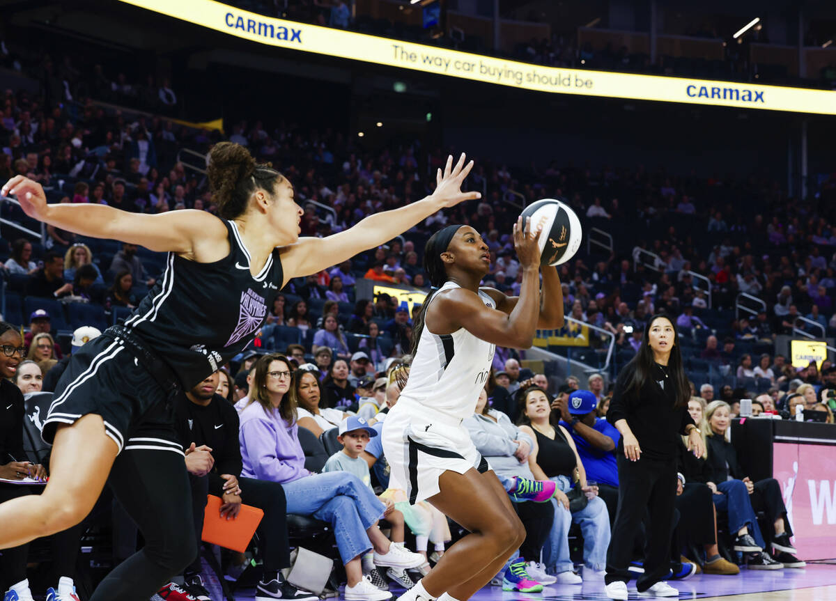 Golden State Valkyries guard Veronica Burton (22) guards against Las Vegas Aces guard Jackie Yo ...