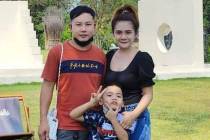 This undated photo provided by the Hostage's Family Forum shows Nattapong Pinta, with his wife ...