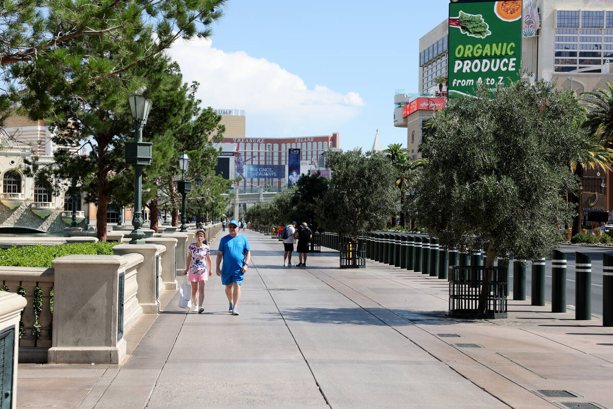 People walk in front of Bellagio on the Strip in Las Vegas Monday, June 9, 2025, near where a s ...