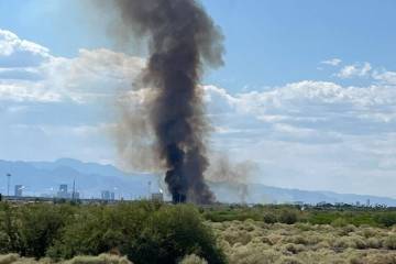 A brush fire at Clark County Wetlands Park is seen Monday, June 9, 2025, in Las Vegas. (Elle Ou ...