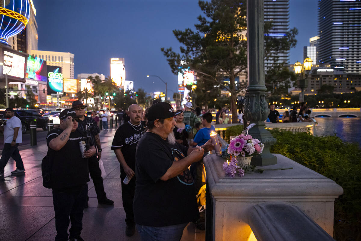 Marc Sanson, a YouTube streamer who goes by TheOtherMeLV, lights candles by the Bellagio Founta ...