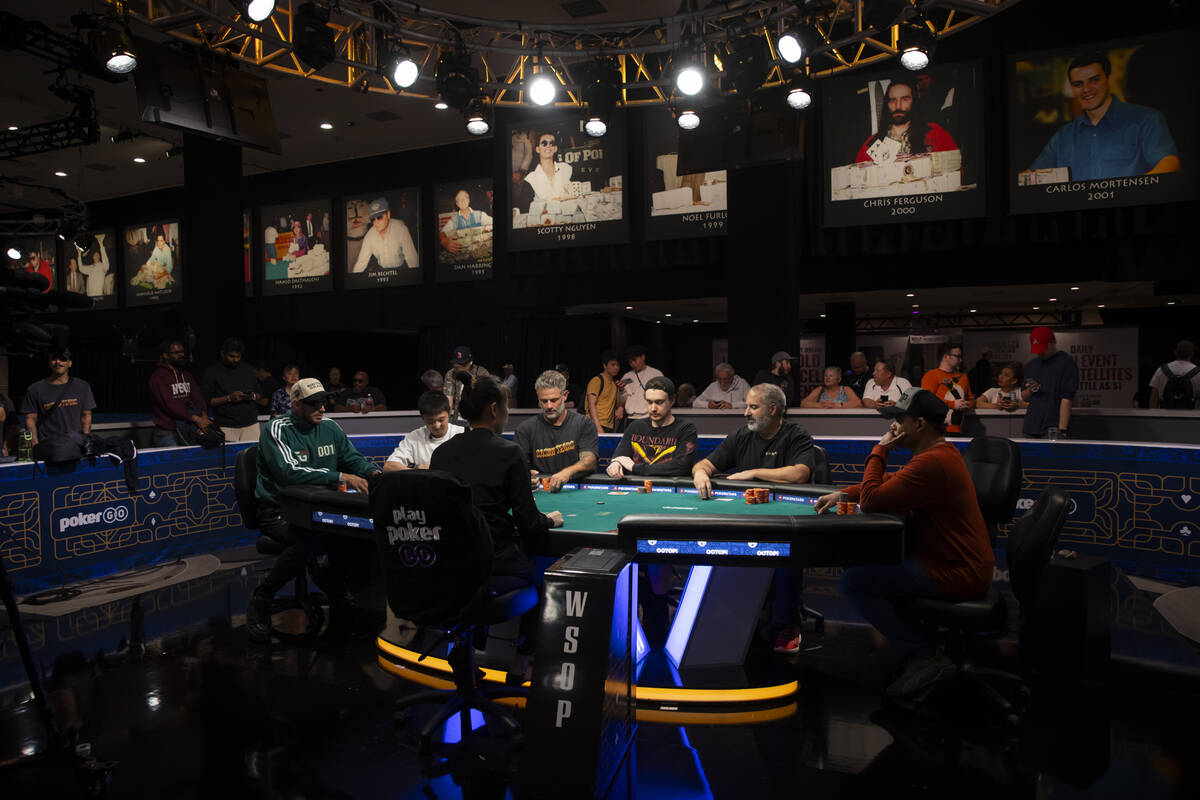 Players compete at the final table in the $500 No-Limit Hold’em Colossus event during th ...