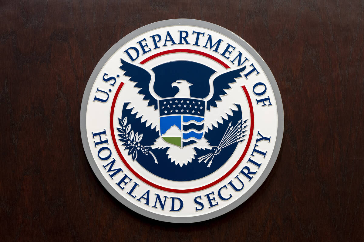 The Department of Homeland Security seal is seen on the podium at the Immigration and Customs E ...