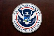 The Department of Homeland Security seal is seen on the podium at the Immigration and Customs E ...