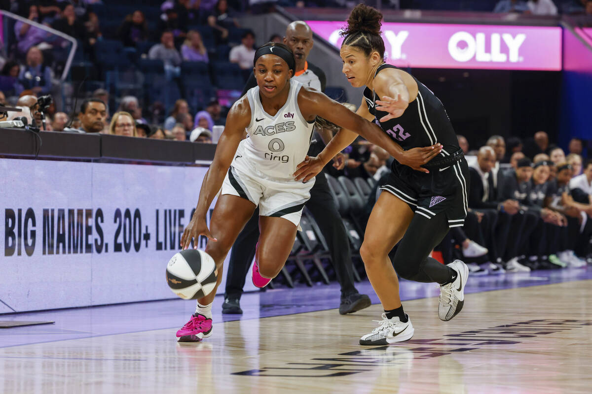 Golden State Valkyries guard Veronica Burton (22) guards against Las Vegas Aces guard Jackie Yo ...