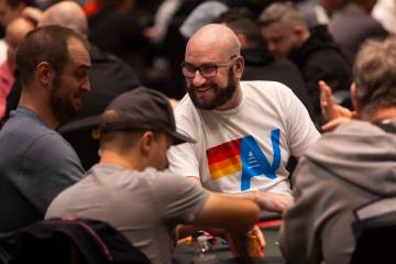 Mike Matusow, wearing glasses, of Henderson, chats with players during in the $10,000 Pot-Limit ...