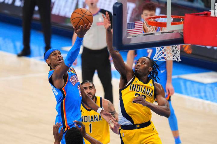 Oklahoma City Thunder guard Shai Gilgeous-Alexander (2) shoots against Indiana Pacers forward A ...