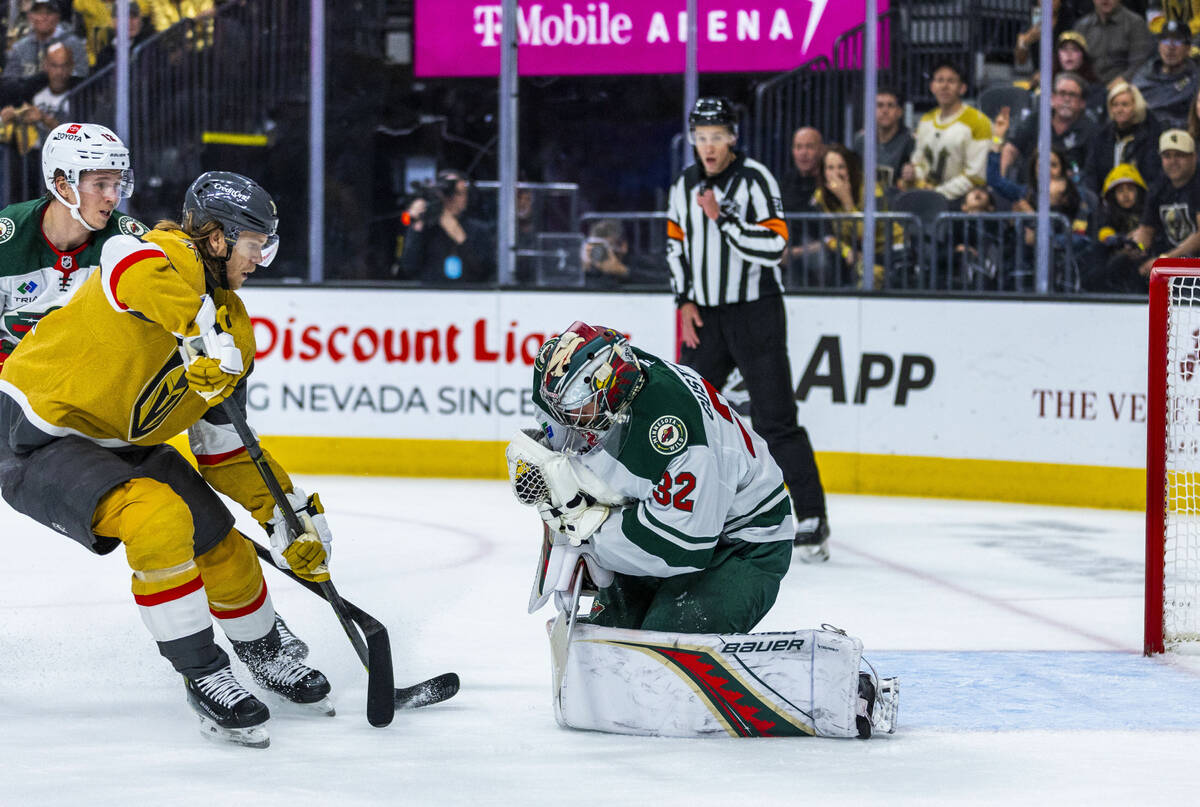Golden Knights center William Karlsson (71) has a shot grabbed by Minnesota Wild goaltender Fil ...