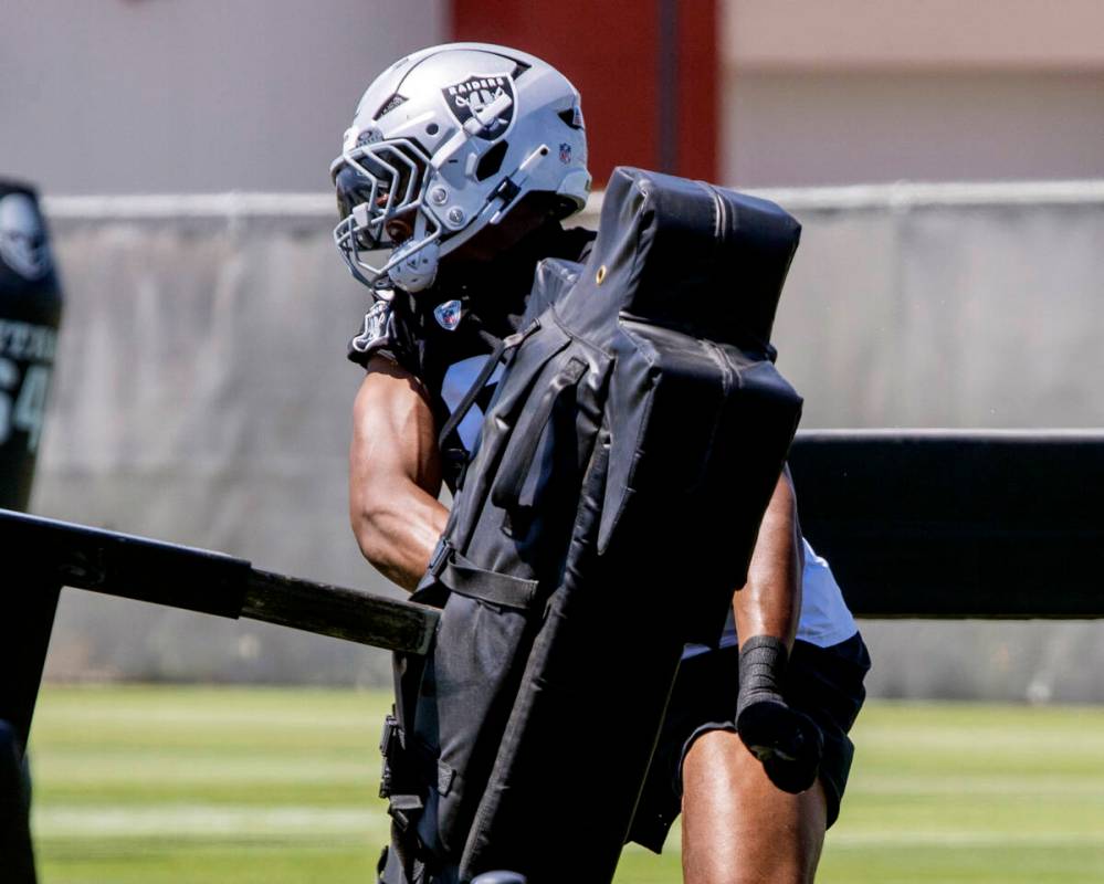 Raiders defensive end Tyree Wilson (9) goes through a tackle drill during an NFL football manda ...