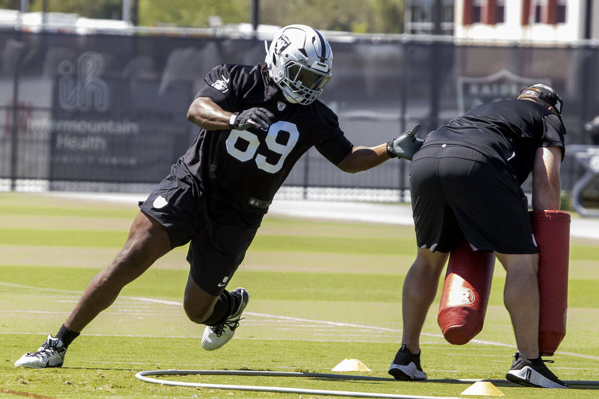 Raiders defensive tackle Adam Butler (69) run through a drill during an NFL football mandatory ...