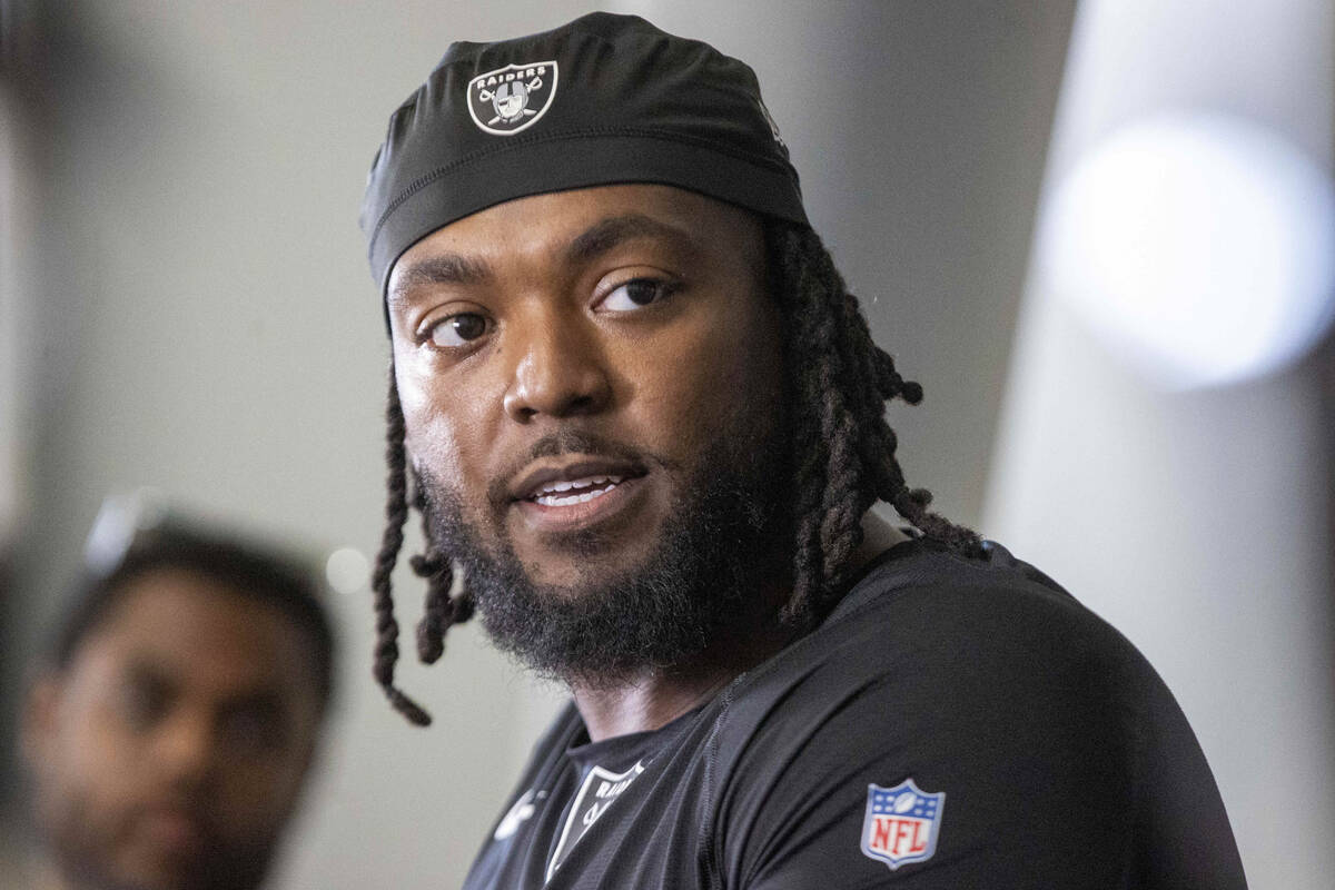 Raiders defensive tackle Adam Butler answers questions during a news conference following an NF ...