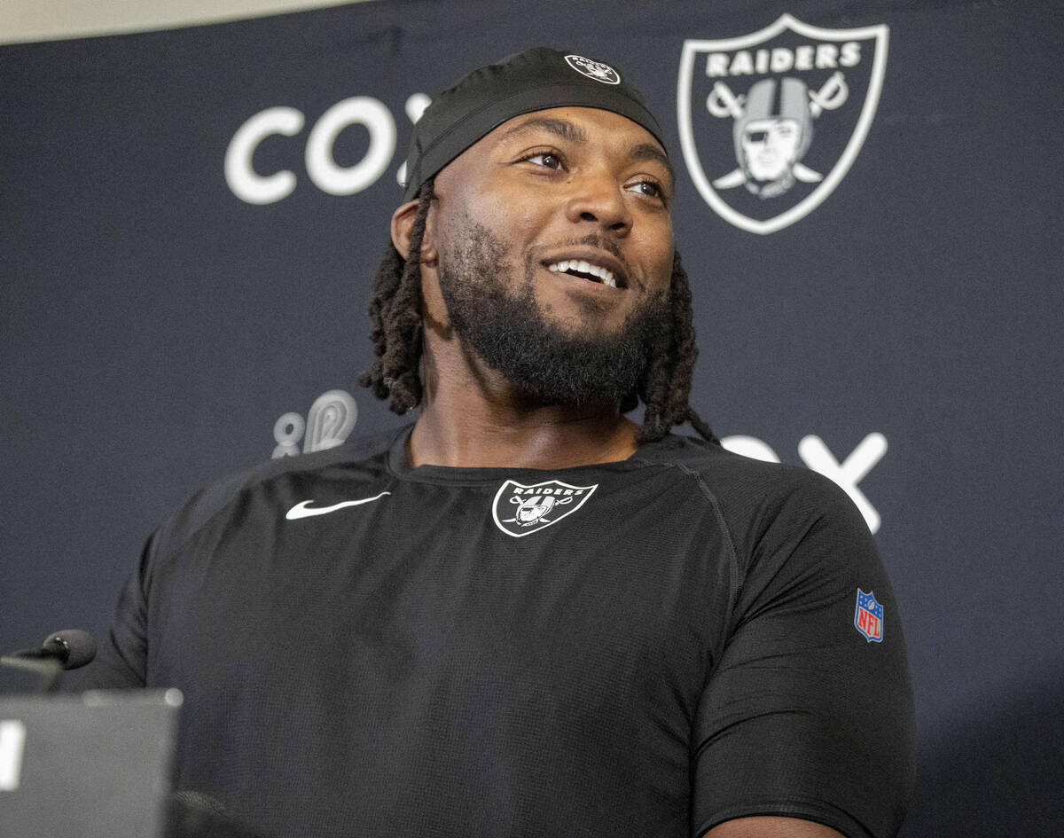 Raiders defensive tackle Adam Butler smiles during a news conference following an NFL football ...