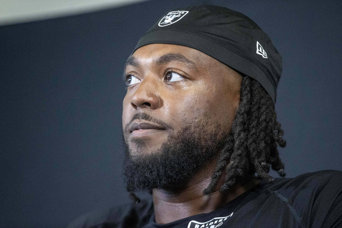 Raiders defensive tackle Adam Butler takes questions during a news conference following an NFL ...