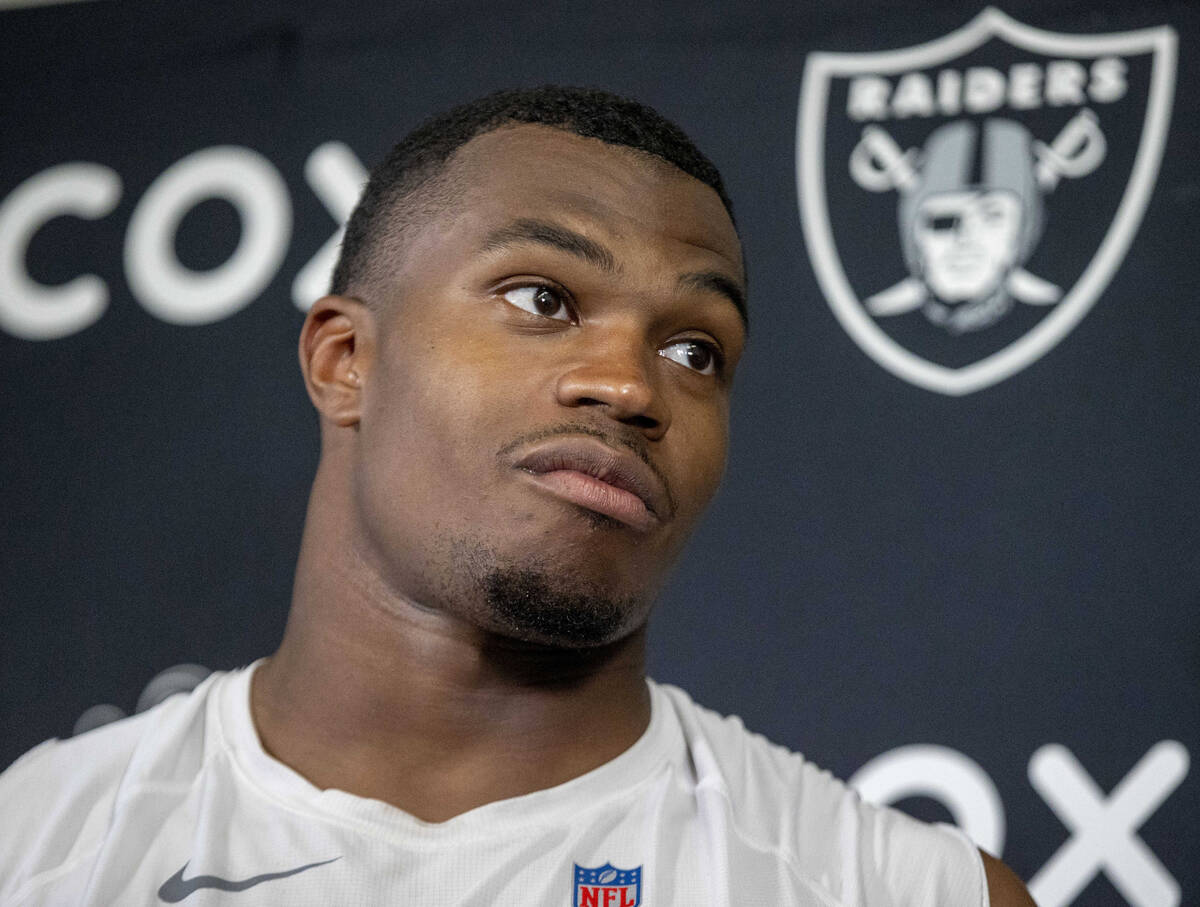 Raiders defensive end Tyree Wilson takes questions during a news conference following an NFL fo ...