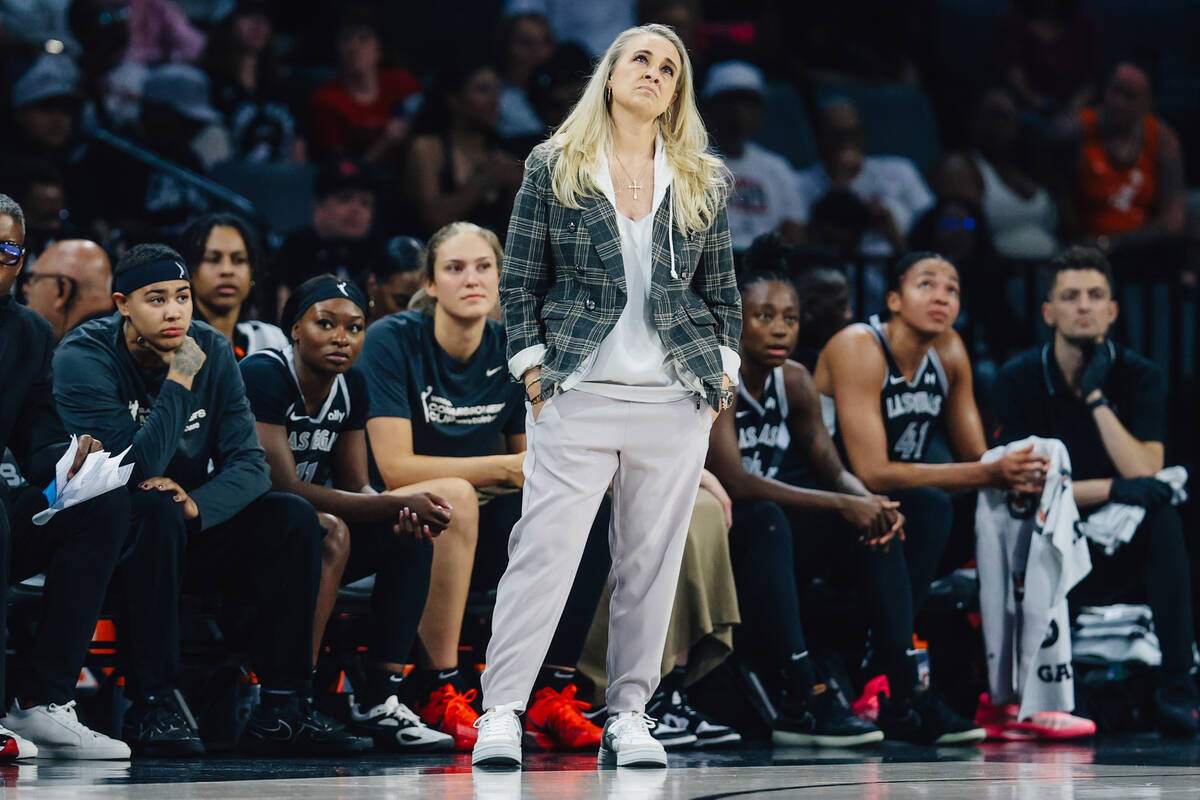 Aces head coach Becky Hammon looks up at the score board as the Aces are down during a WNBA bas ...